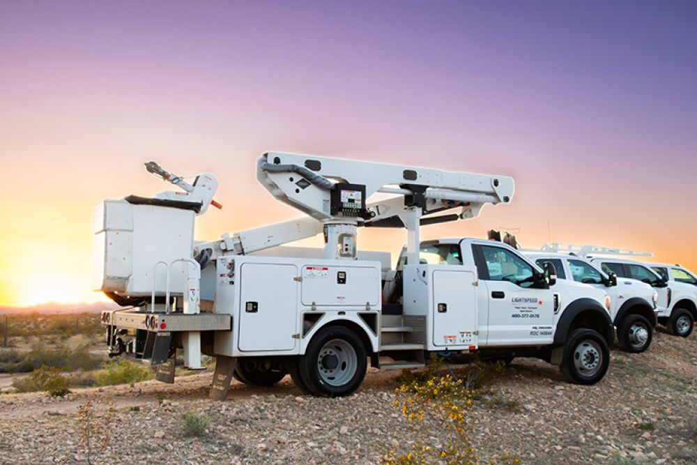 lightspeed trucks framed against a desert sunset